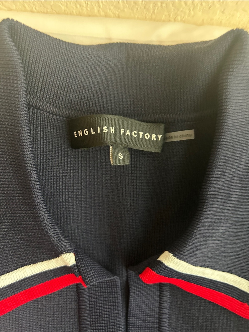 English Factory Navy Polo Knit Dress with White Pleated Hem and Red Trim - Picture 2 of 5